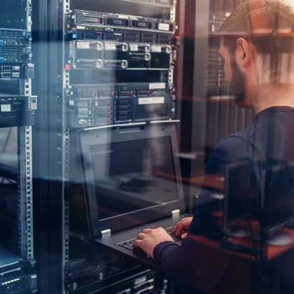 Engineer Working in Server Room